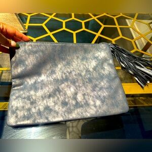 Blue and silver clutch bag with a zipper.